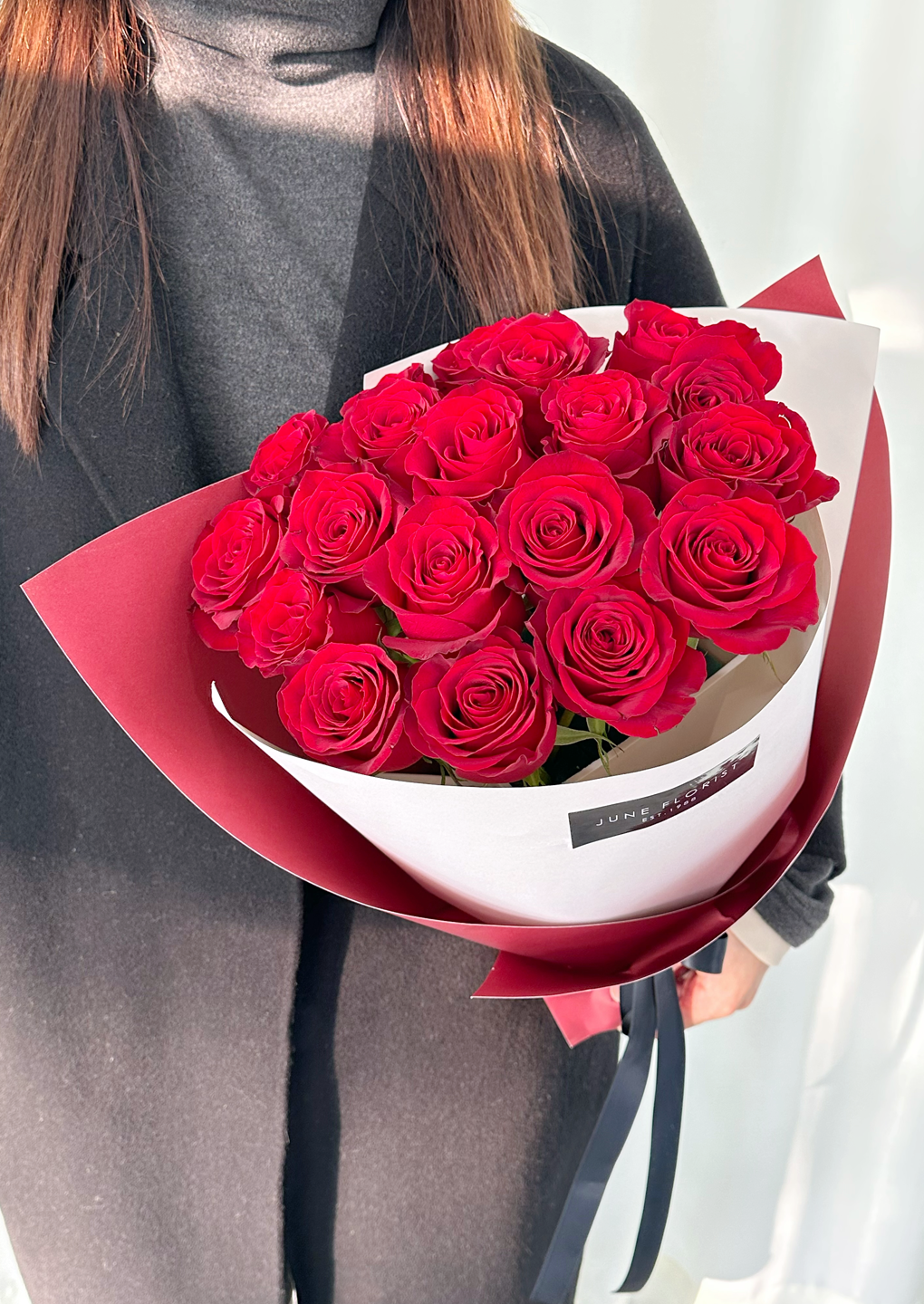 Love’s Embrace      (18 Roses)