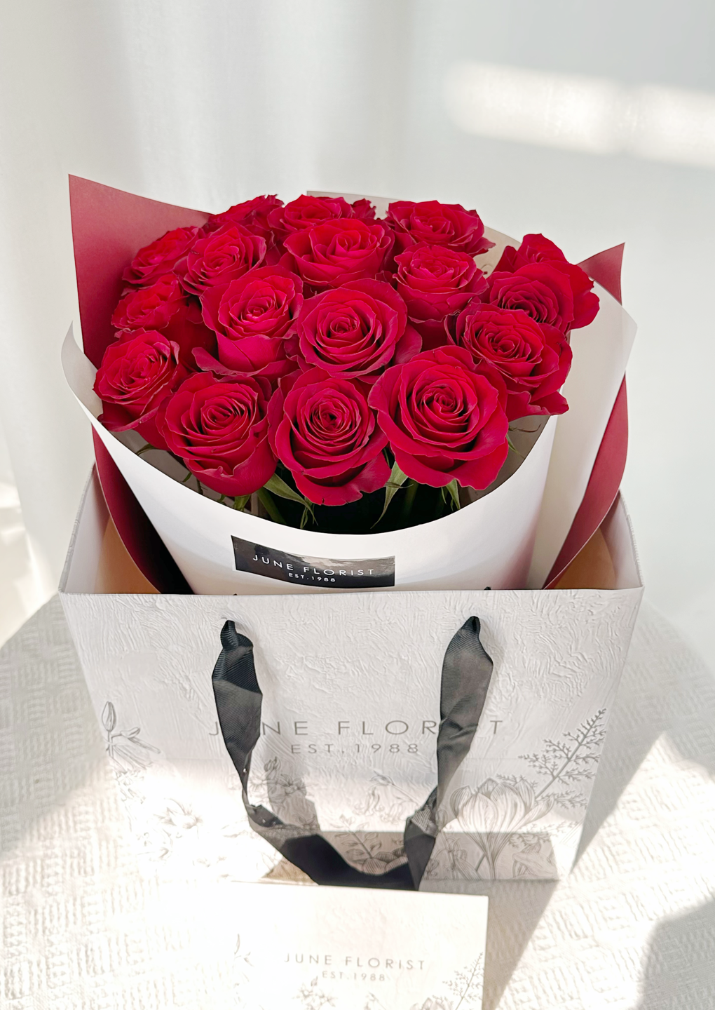 Love’s Embrace      (18 Roses)